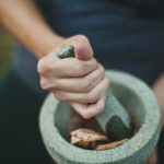 person making taditional chinese medicine